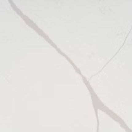 A close up of a white quartz with a gray marble finish.