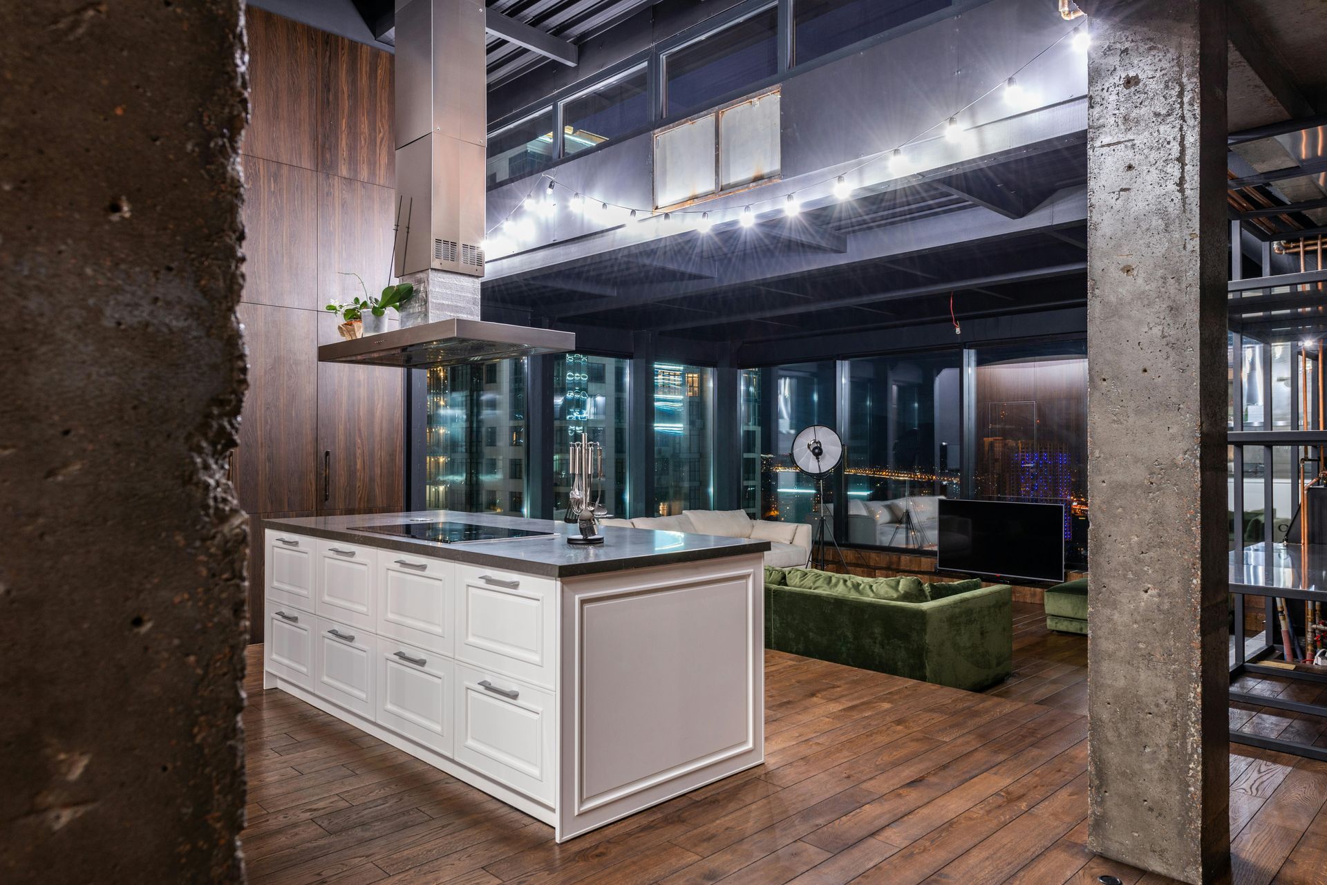 A luxury modern kitchen with wood floors