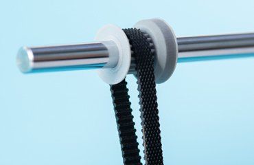 Axis gear pulling a belt