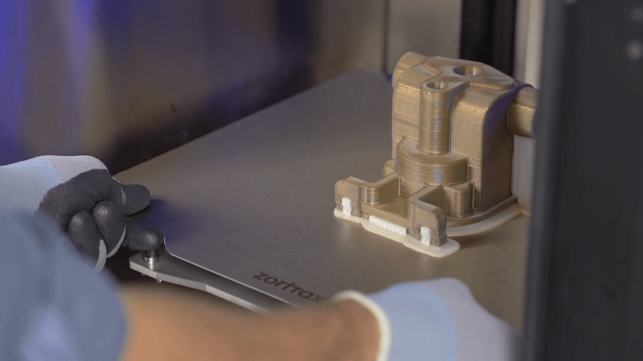 Engineer must wear safety glove when take out parts from heated chamber 3d printer
