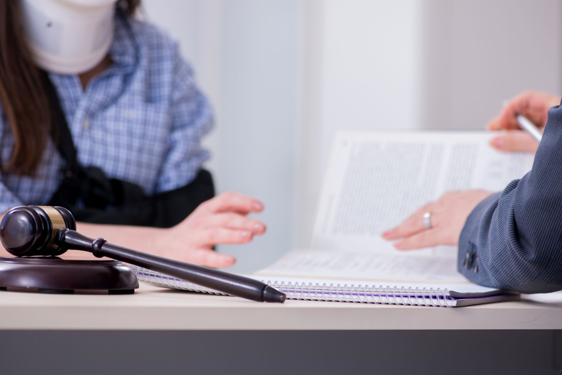 Injured employee visiting workers' compensation attorney. Injured employee visiting workers' compensation attorney.