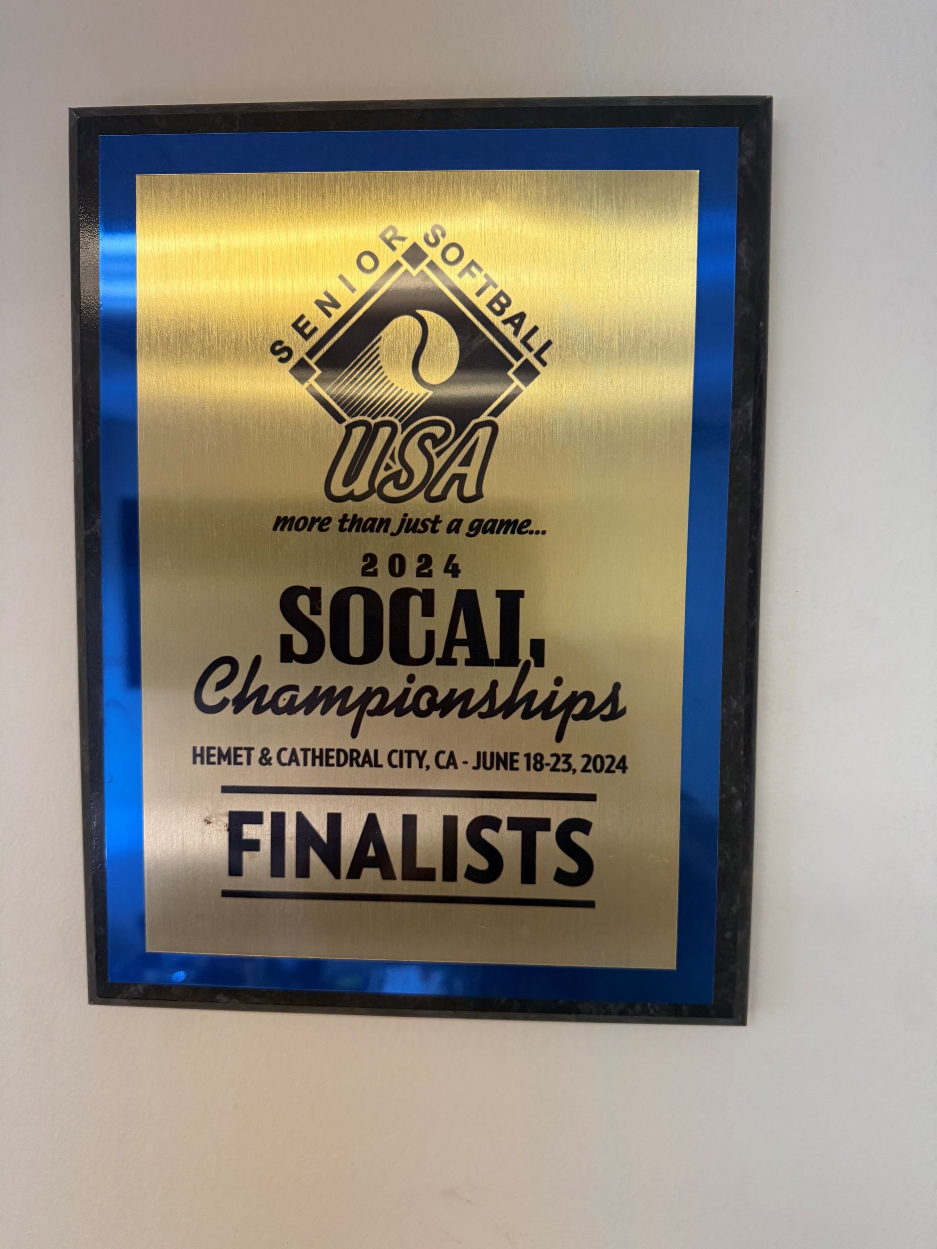 Blue-framed gold plaque reading “USCA National Social Championships” with “Finalists” at bottom