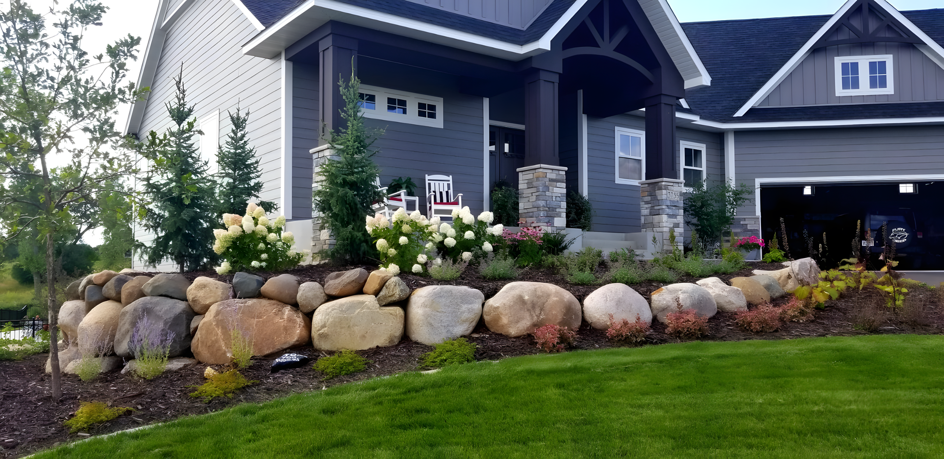 A house with a lot of rocks in front of it