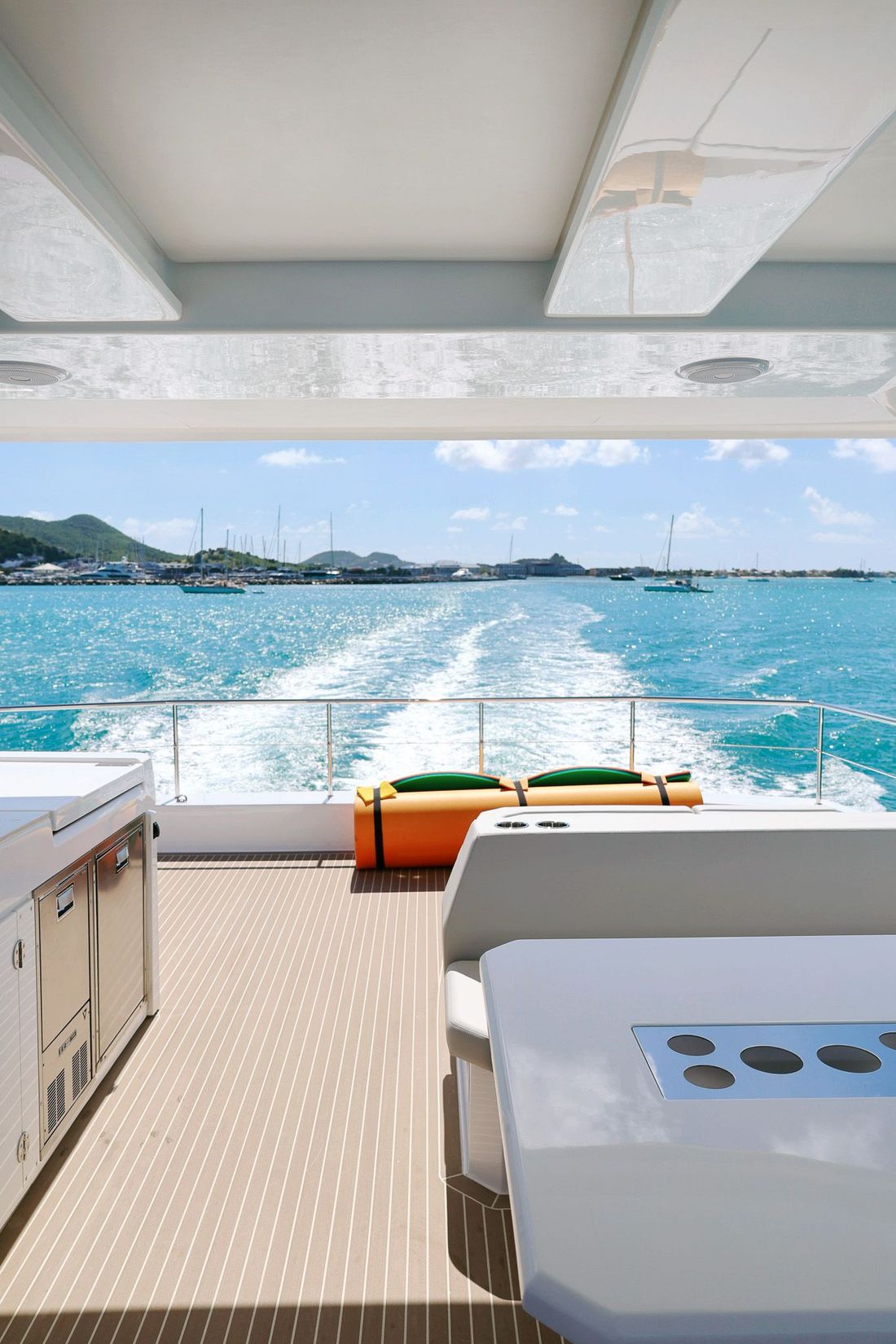 Leopard 53 Power Catamaran by Arawak Charters cutting through Caribbean waves near Saint Martin, Marigot.