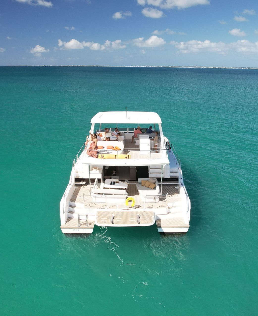 Aerial drone view fom the back of the Leopard 53 Power Catamaran by Arawak Charters cruising near Anguilla, Caribbean.