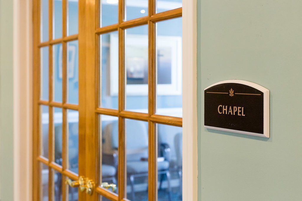 Wooden chapel doors with a sign that reads 