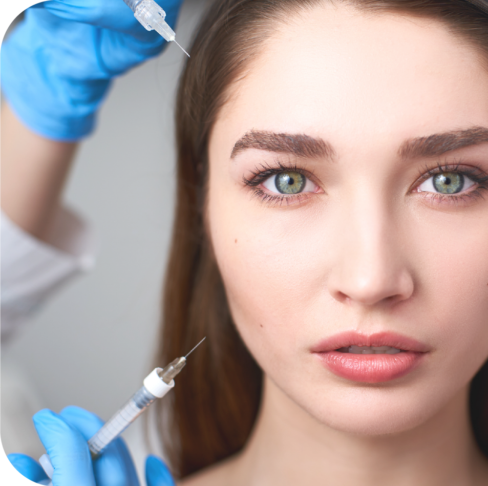 A woman is getting a botox injection in her forehead.