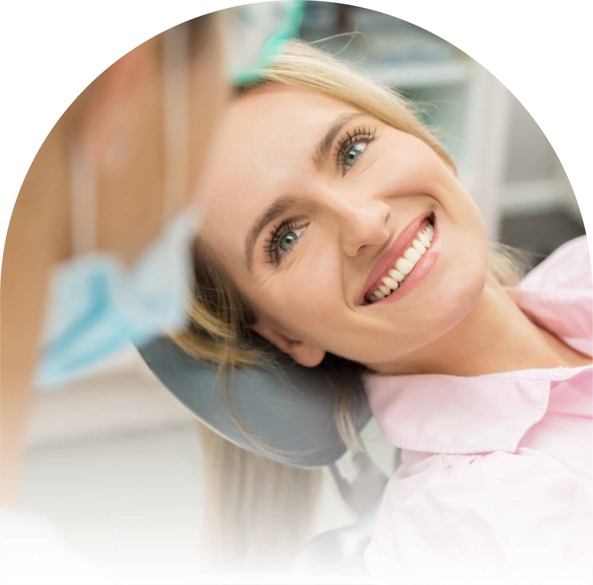 A woman is smiling while sitting in a chair
