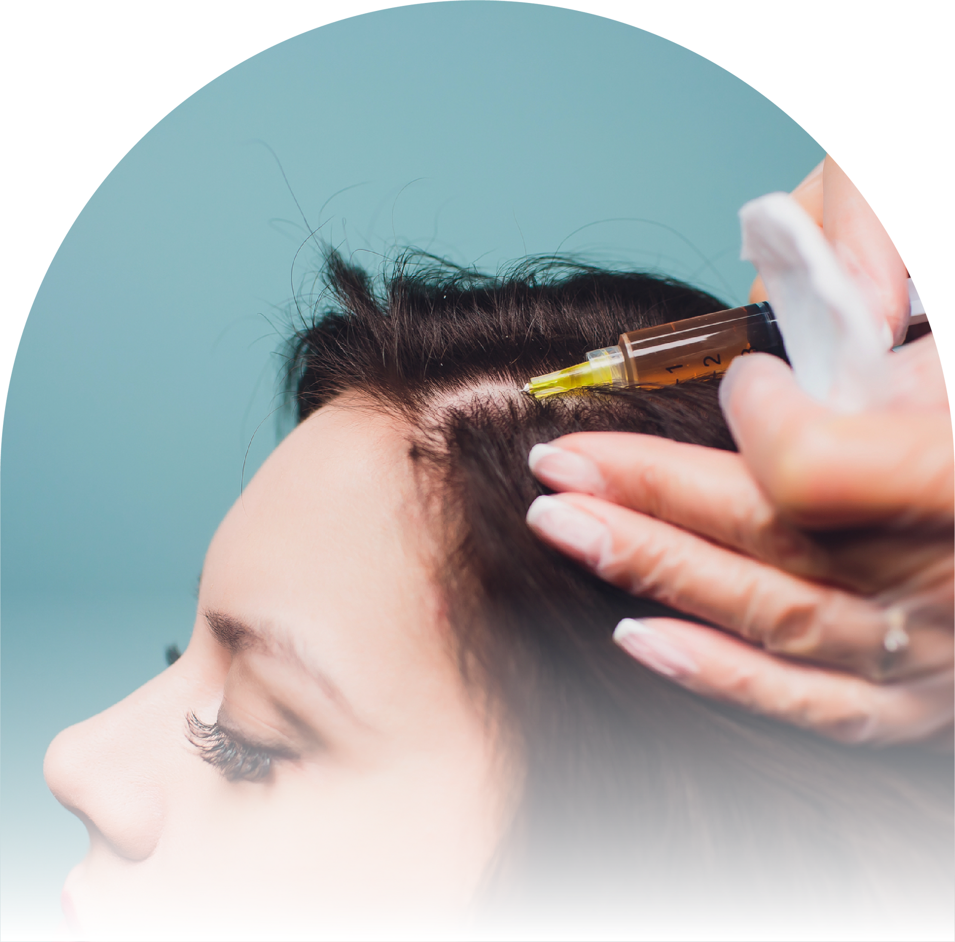 A woman is getting an injection in her hair.