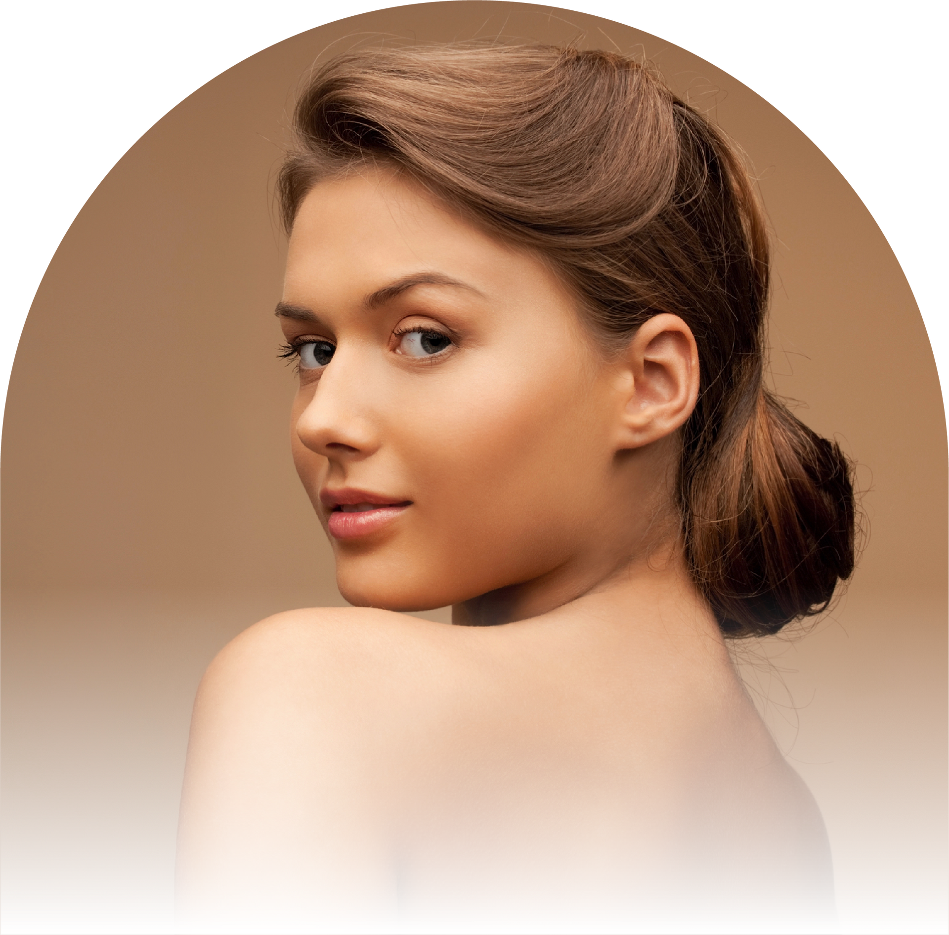 A woman with her hair in a bun is looking over her shoulder.