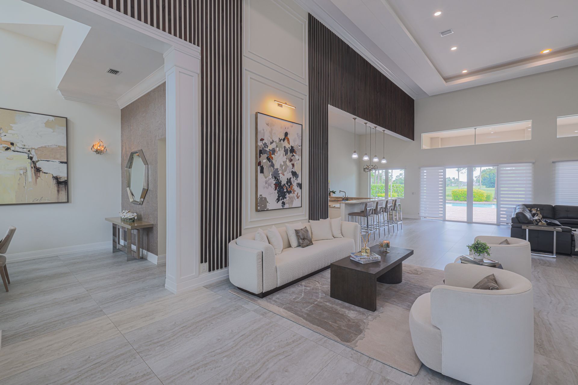A living room with a large sectional couch and a coffee table.