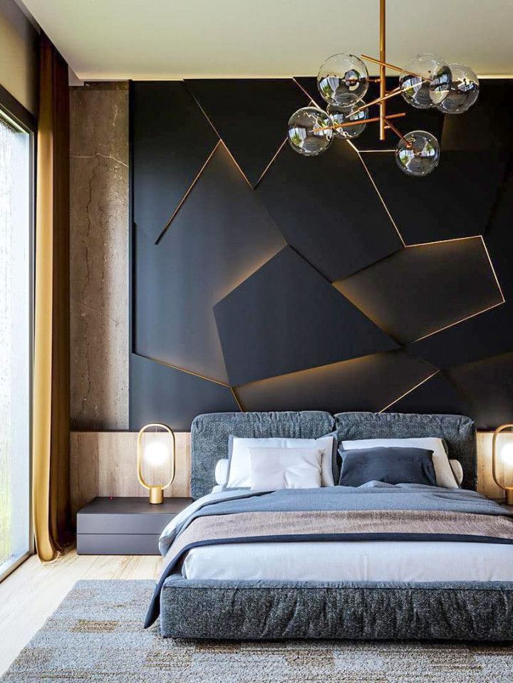 A bedroom with a large bed and a black wall