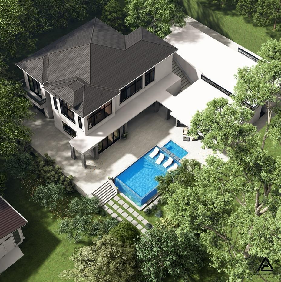 Aerial view of a modern white house with a pool, surrounded by trees and green lawn.