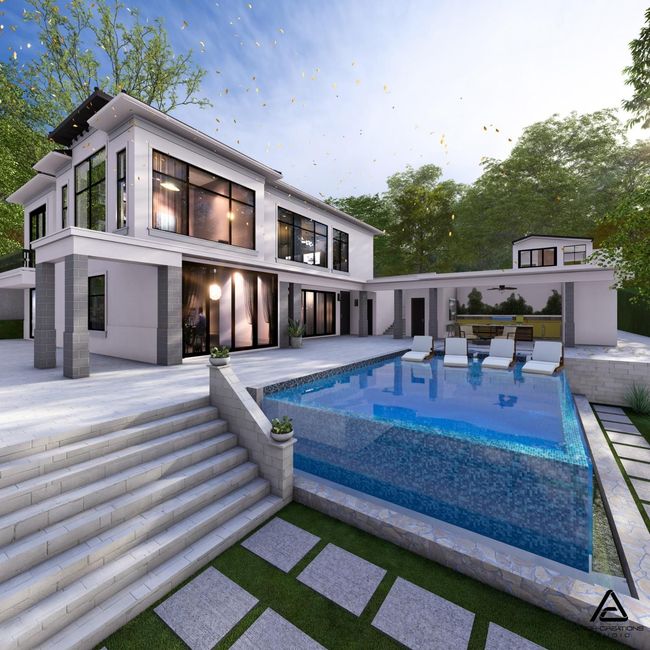 Modern white house with a pool, outdoor seating, and steps on a sunny day.