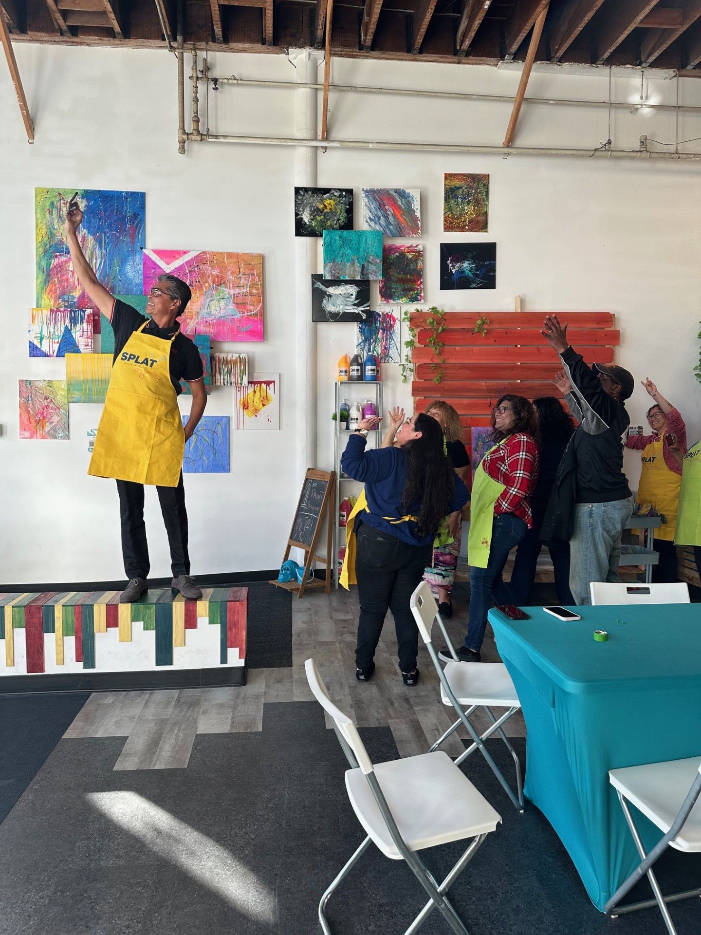 group taking a picture at Splat art studio 