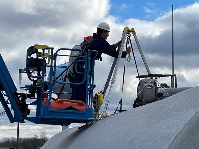 Man in lift working in a Confined Space Rescue operation.