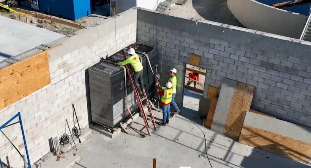 Trane Stulz CyberAir cooling equipment installed with new truss and roofing construction for a coastal Florida electrical facility