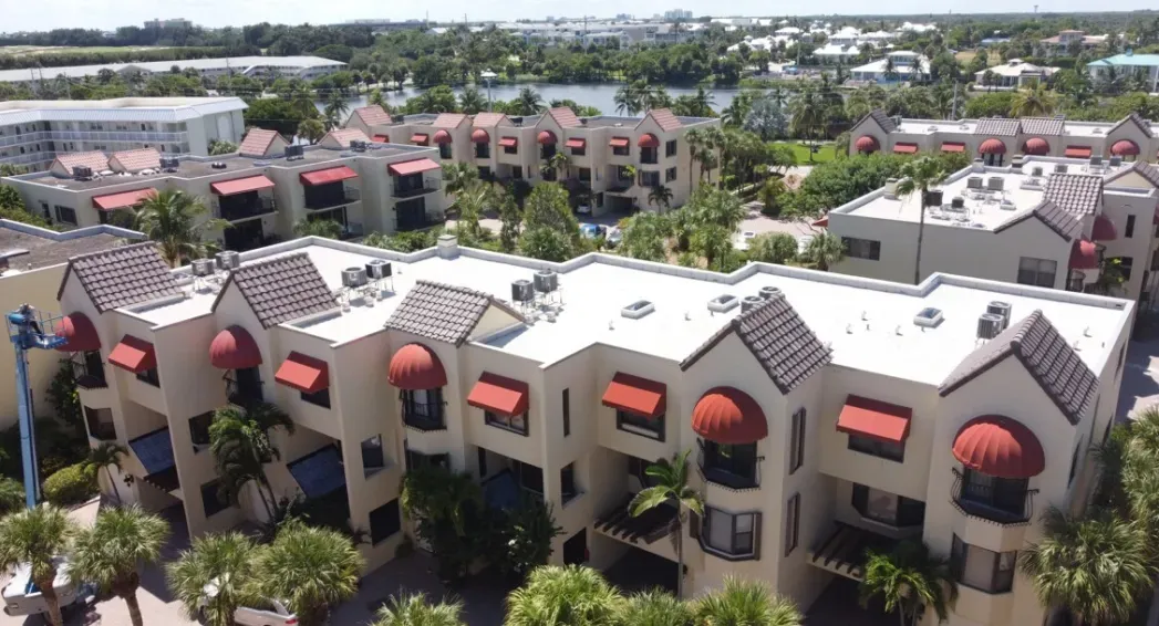 Modified bitumen and tile roof replacement with new HVAC stands at Cote De La Mer Condominiums in Juno Beach, Florida