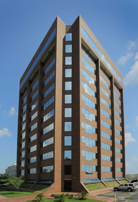 A tall brick building with a lot of windows