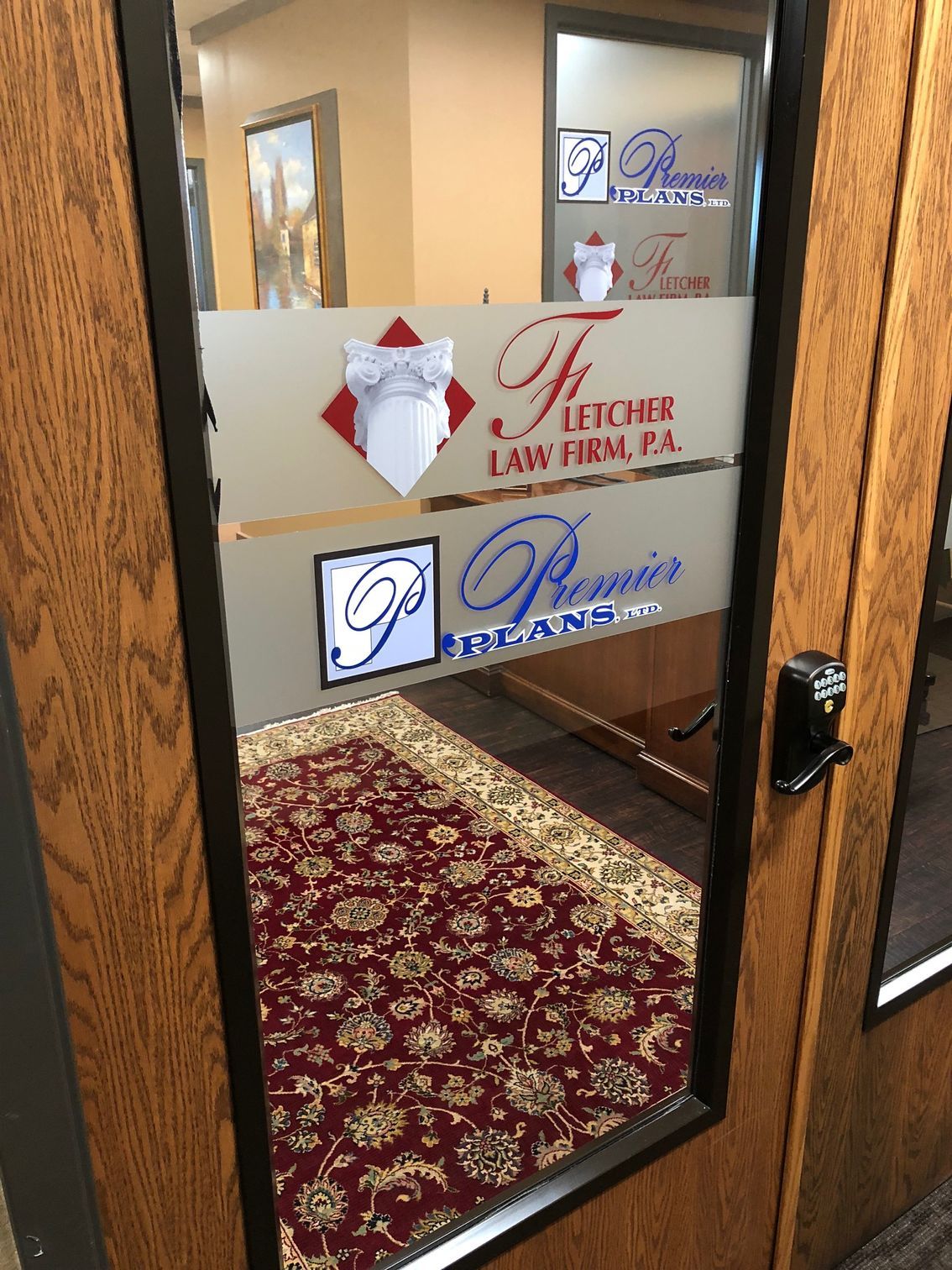 A door with a sticker on it that says letcher law firm pa