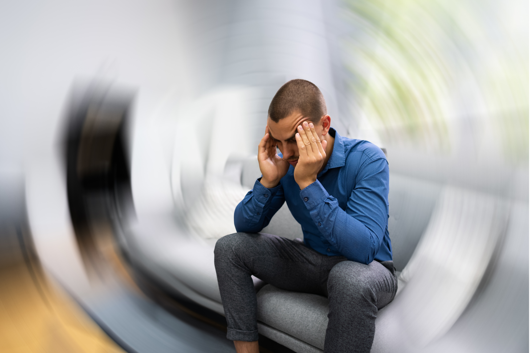 Person showing extreme tiredness and discomfort, a common complaint of people living with Behçet's Disease
