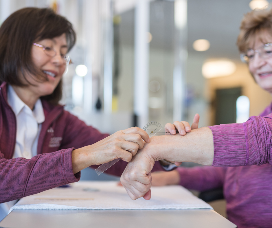 Occupational therapist measuring a woman's wrist for wrist braces