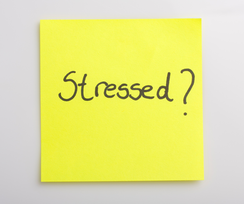 Stressed written on a yellow sticky note. 