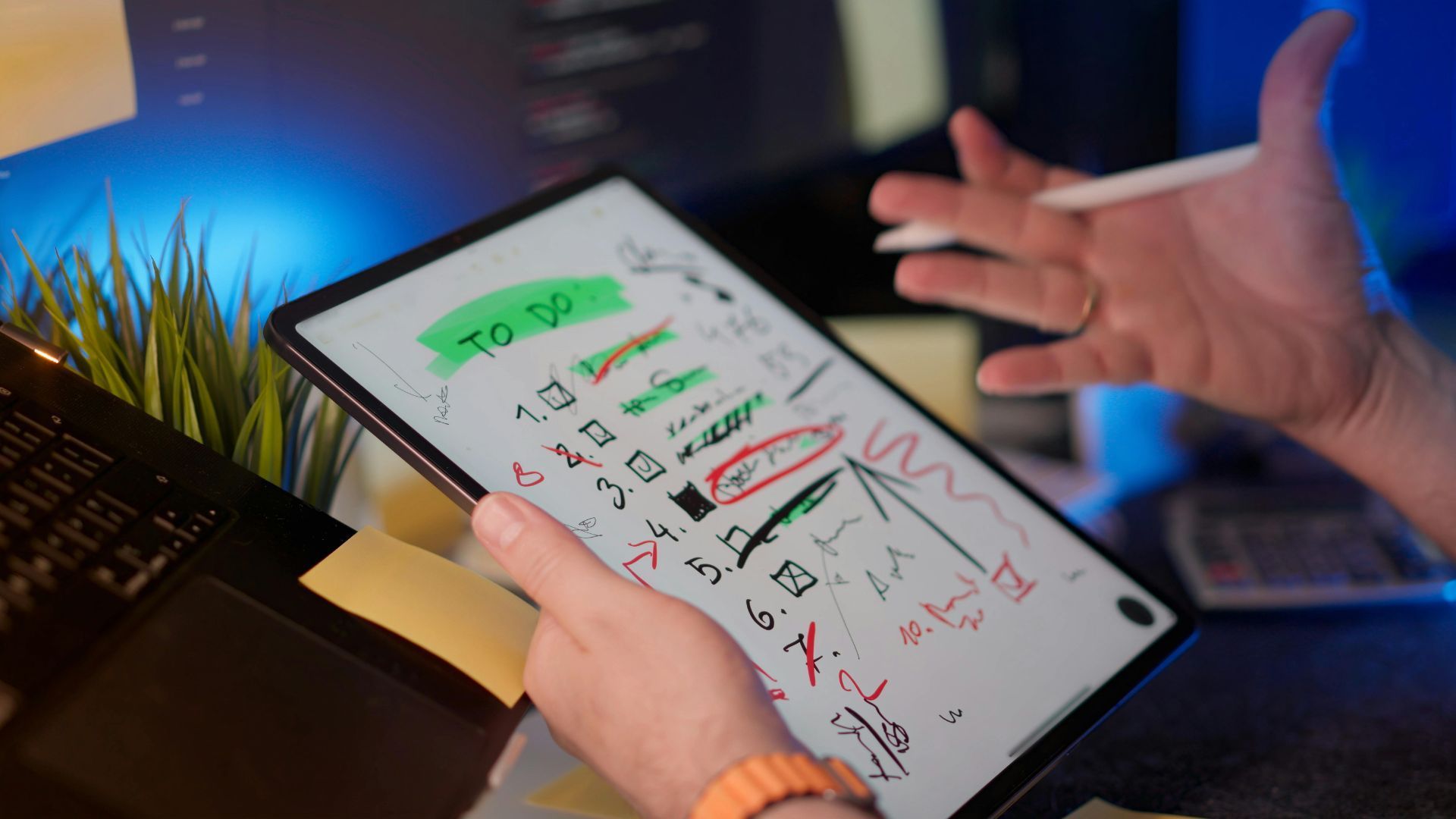 Person holding a tablet with a 