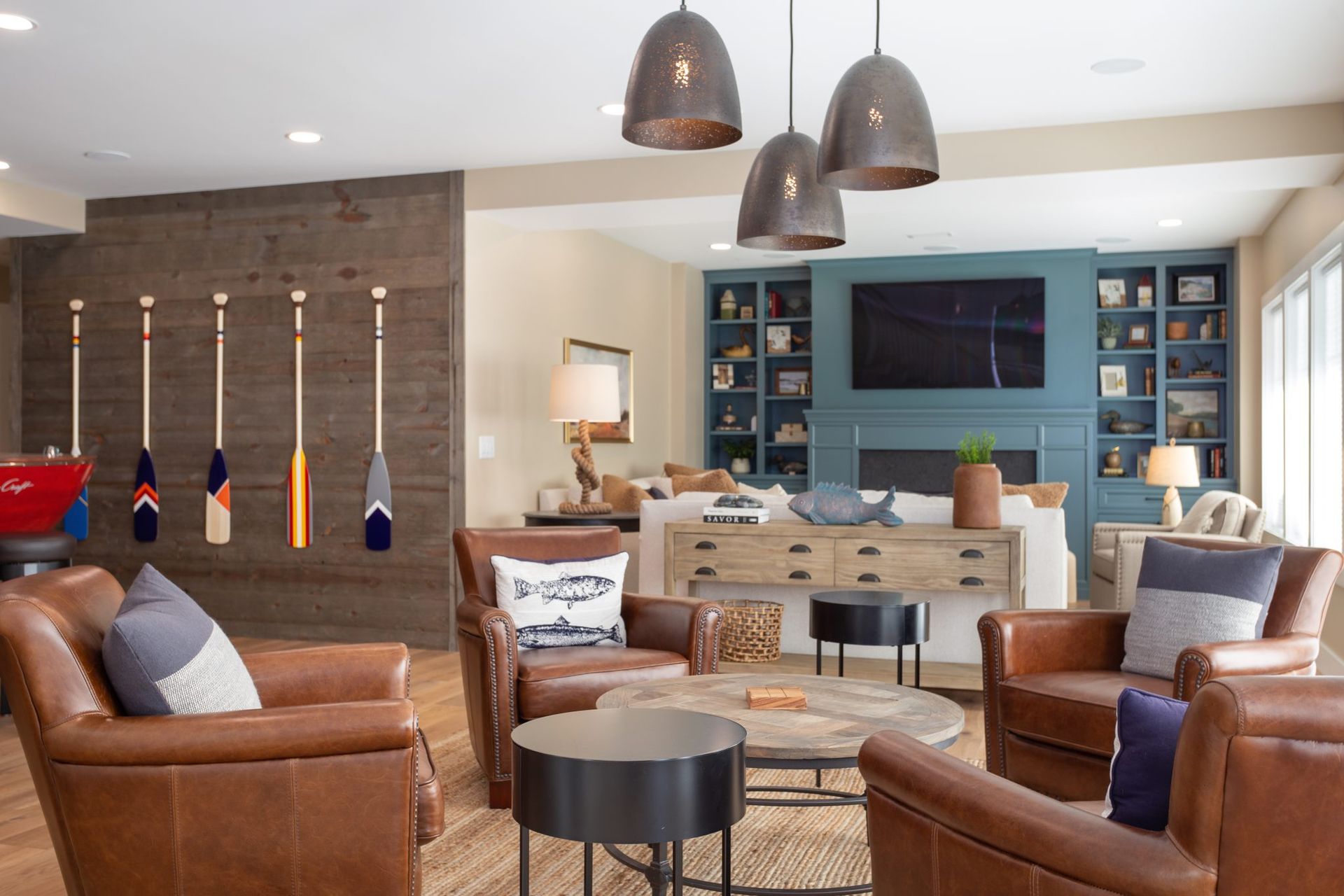 A living room filled with furniture and a pool table.