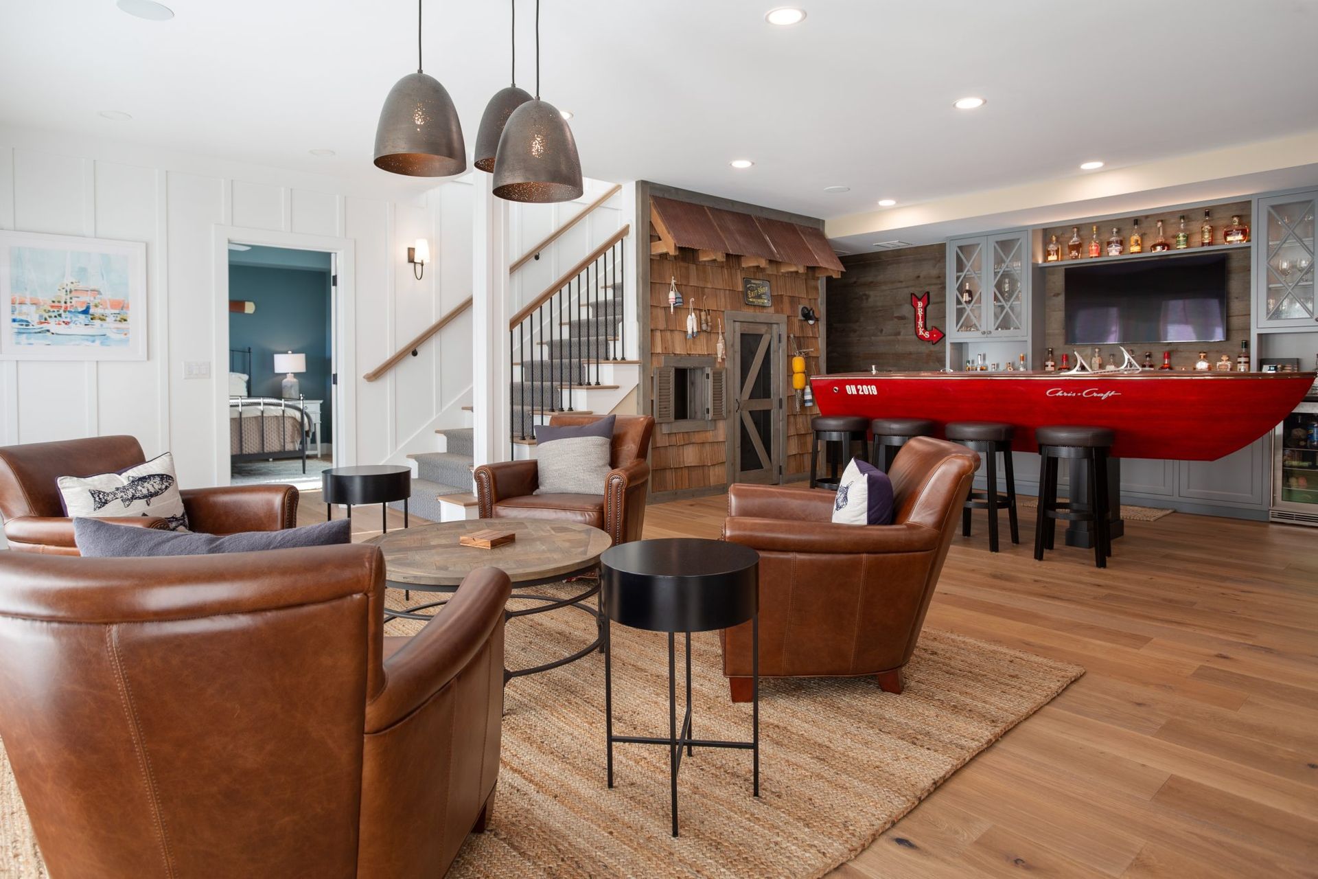 A living room filled with furniture and a red bar.