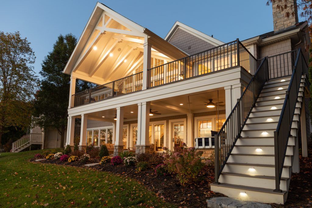 A large house with stairs leading up to the second floor.