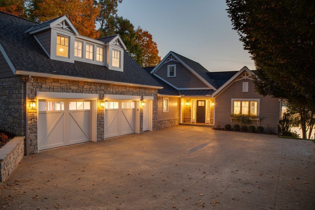 A large house with a lot of garage doors.