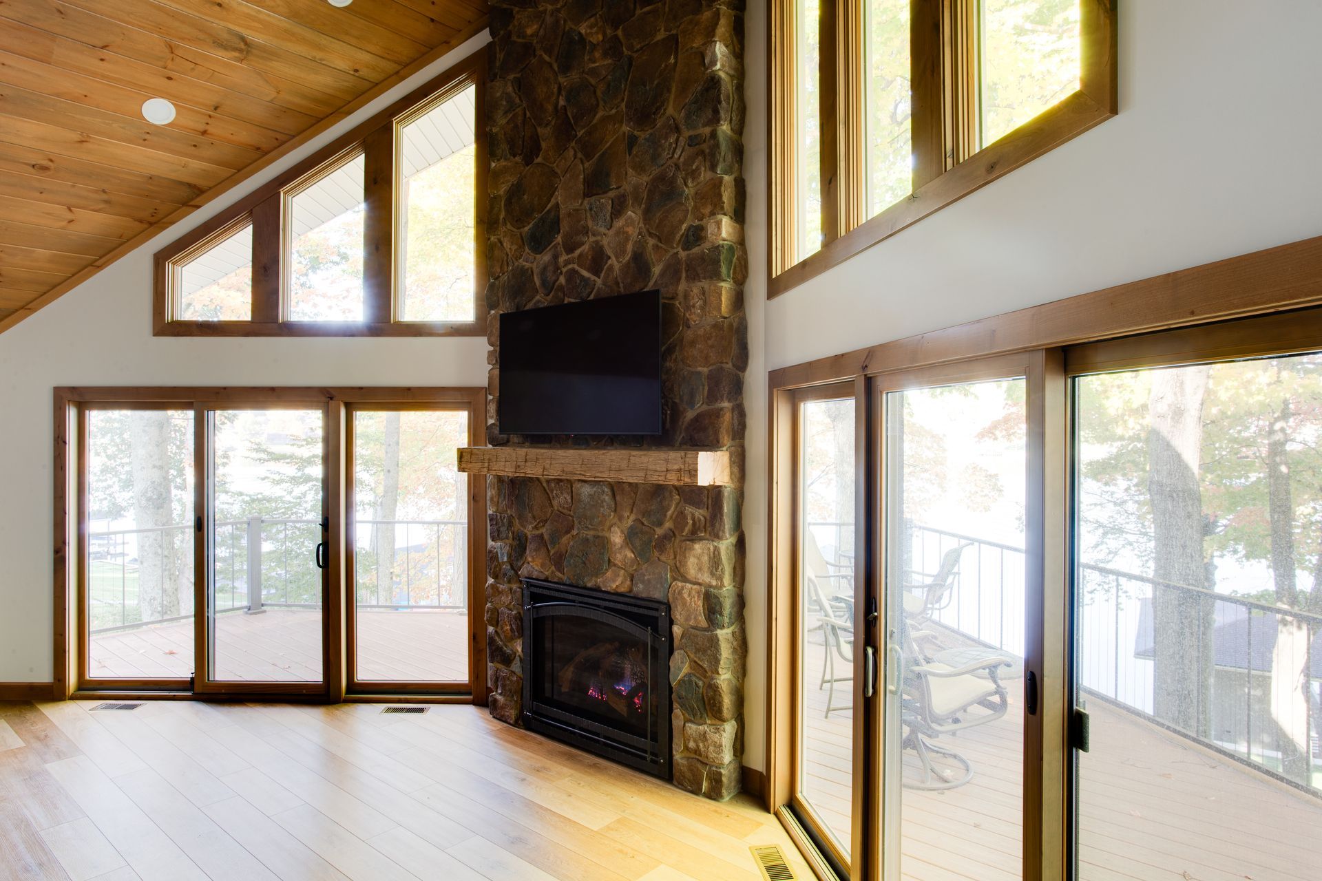 A living room with a fireplace and sliding glass doors.