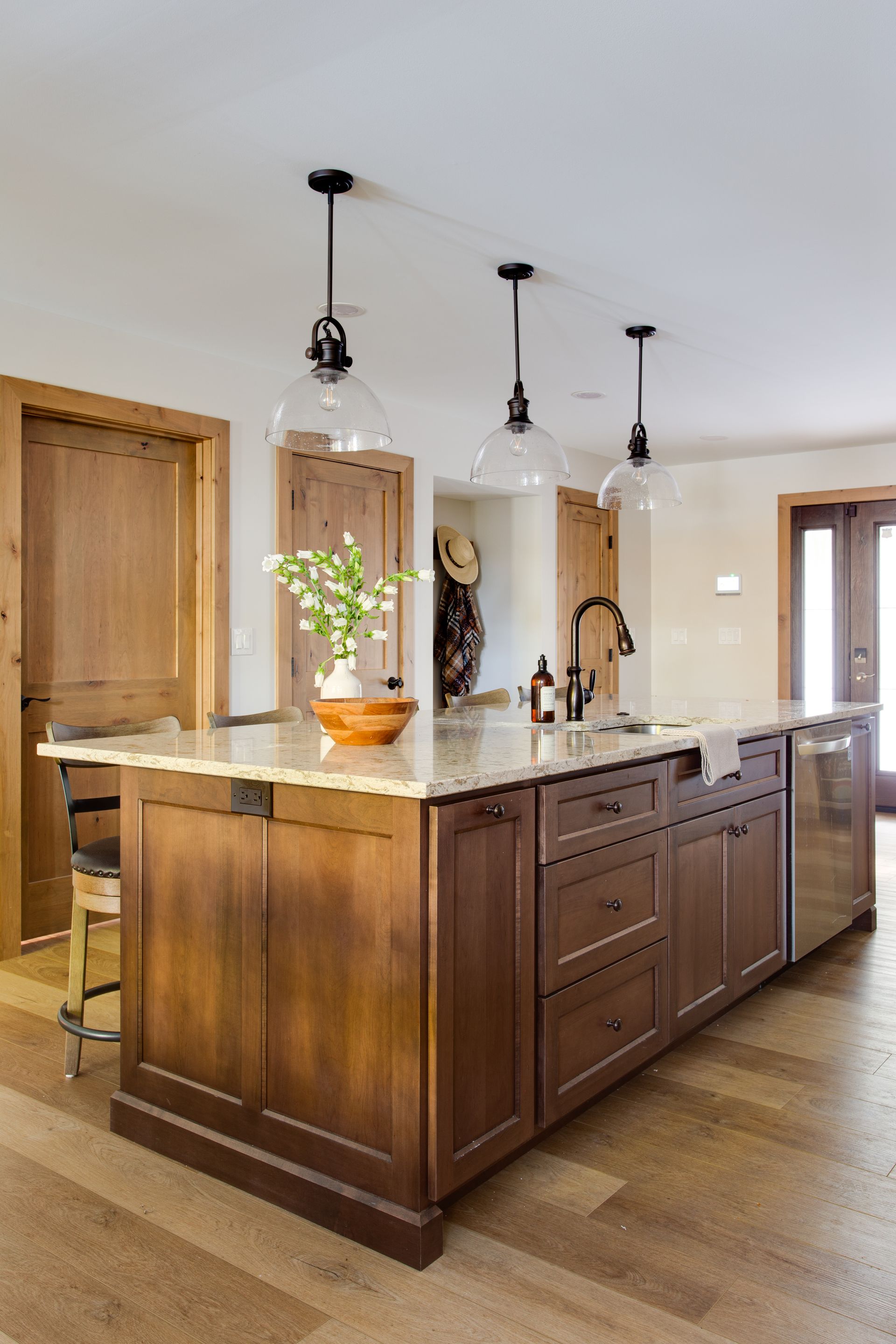 A kitchen with a large island in the middle of it.