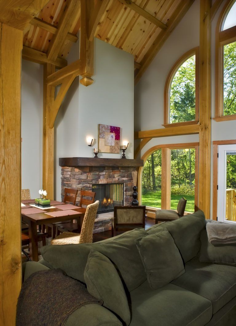 A living room with a fireplace and a couch