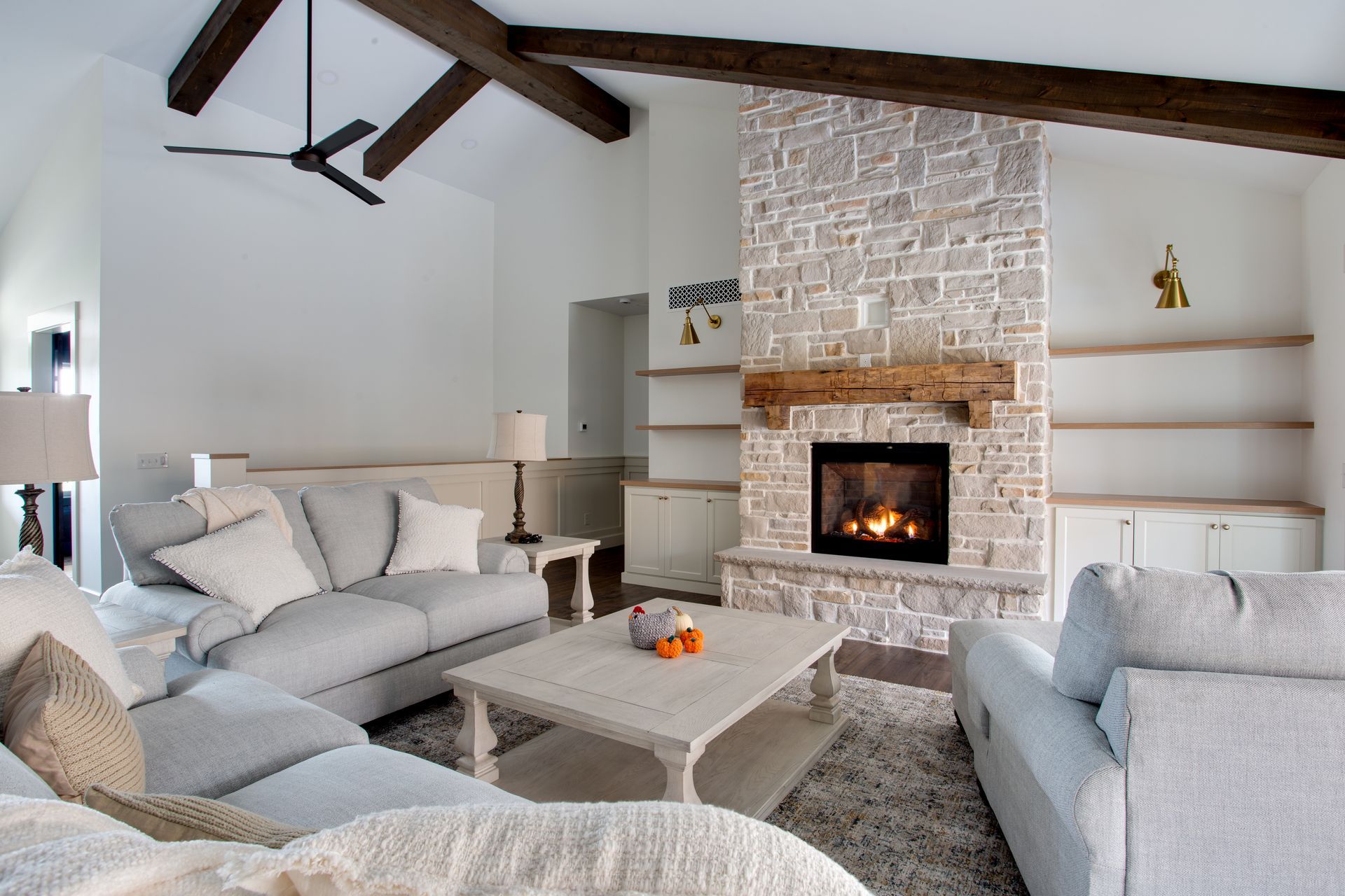 There is a fireplace in the middle of the living room.