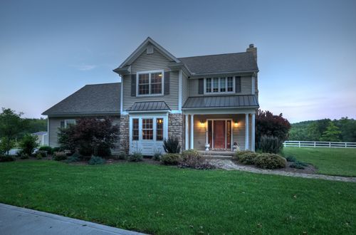 A large house with a large lawn in front of it
