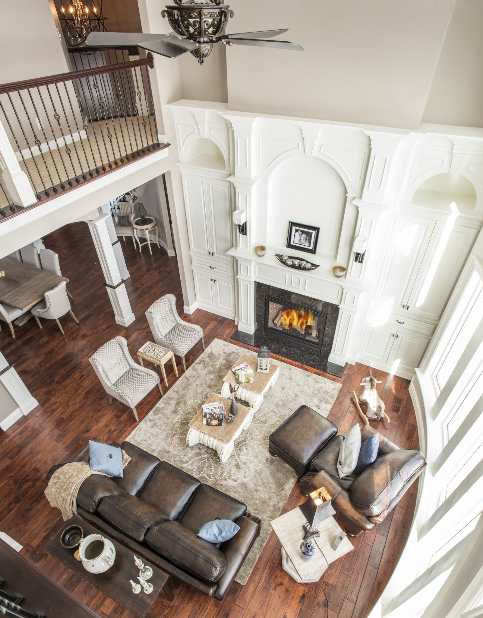 An aerial view of a living room filled with furniture and a fireplace.