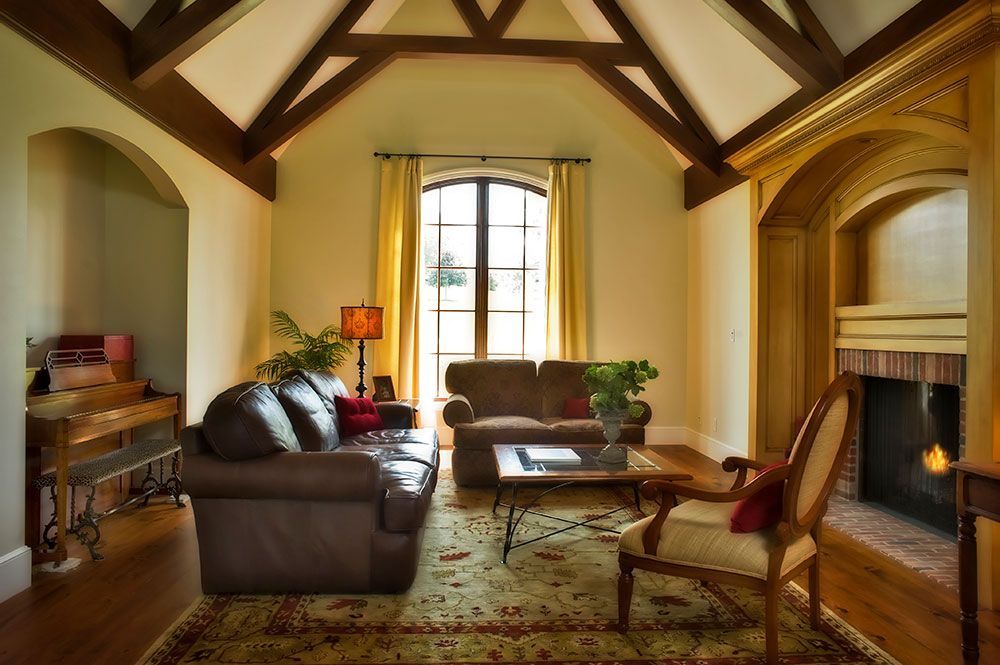 A living room with a fireplace and a couch.