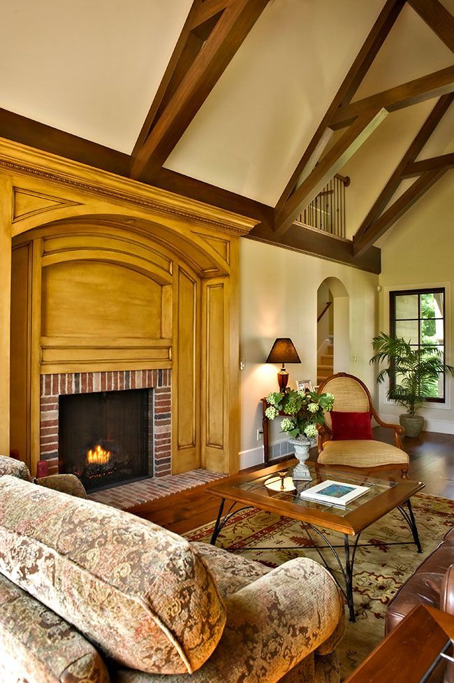 A living room with a fireplace and a couch.