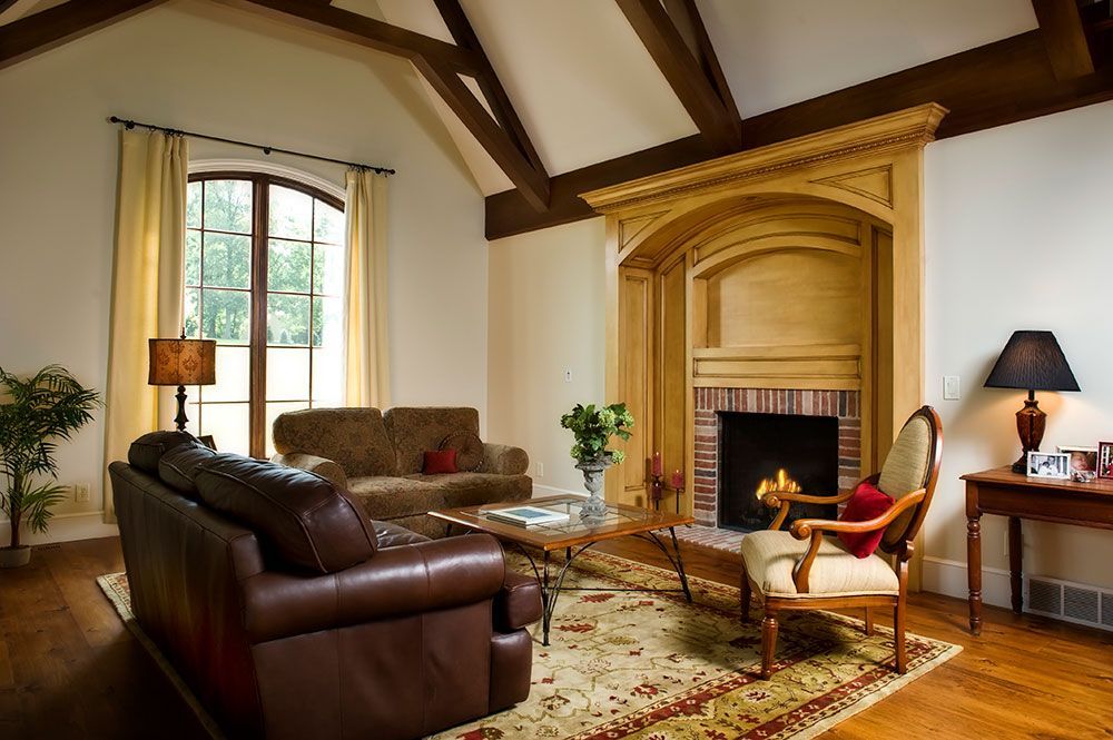 A living room with a fireplace and a couch.