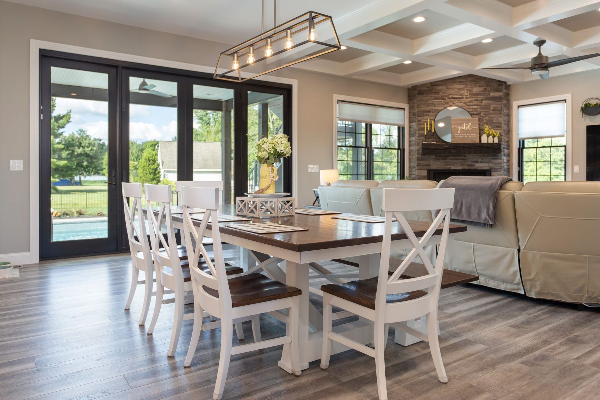There is a dining table and chairs in the middle of the room.