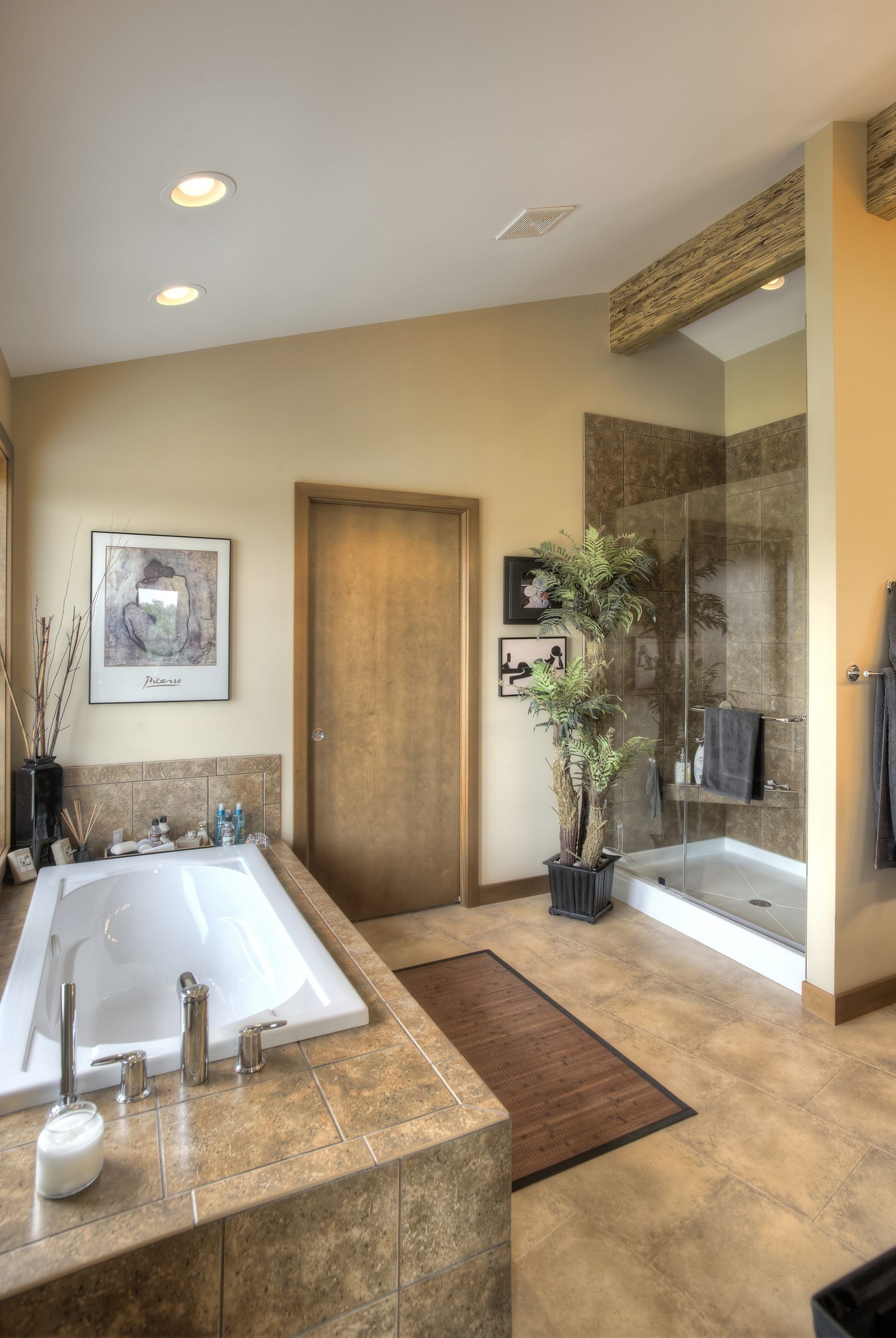 A bathroom with a bathtub and a walk in shower