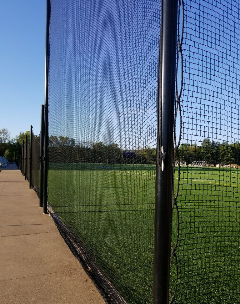 A baseball field is behind a fence with a time stamp of 8:11 am.