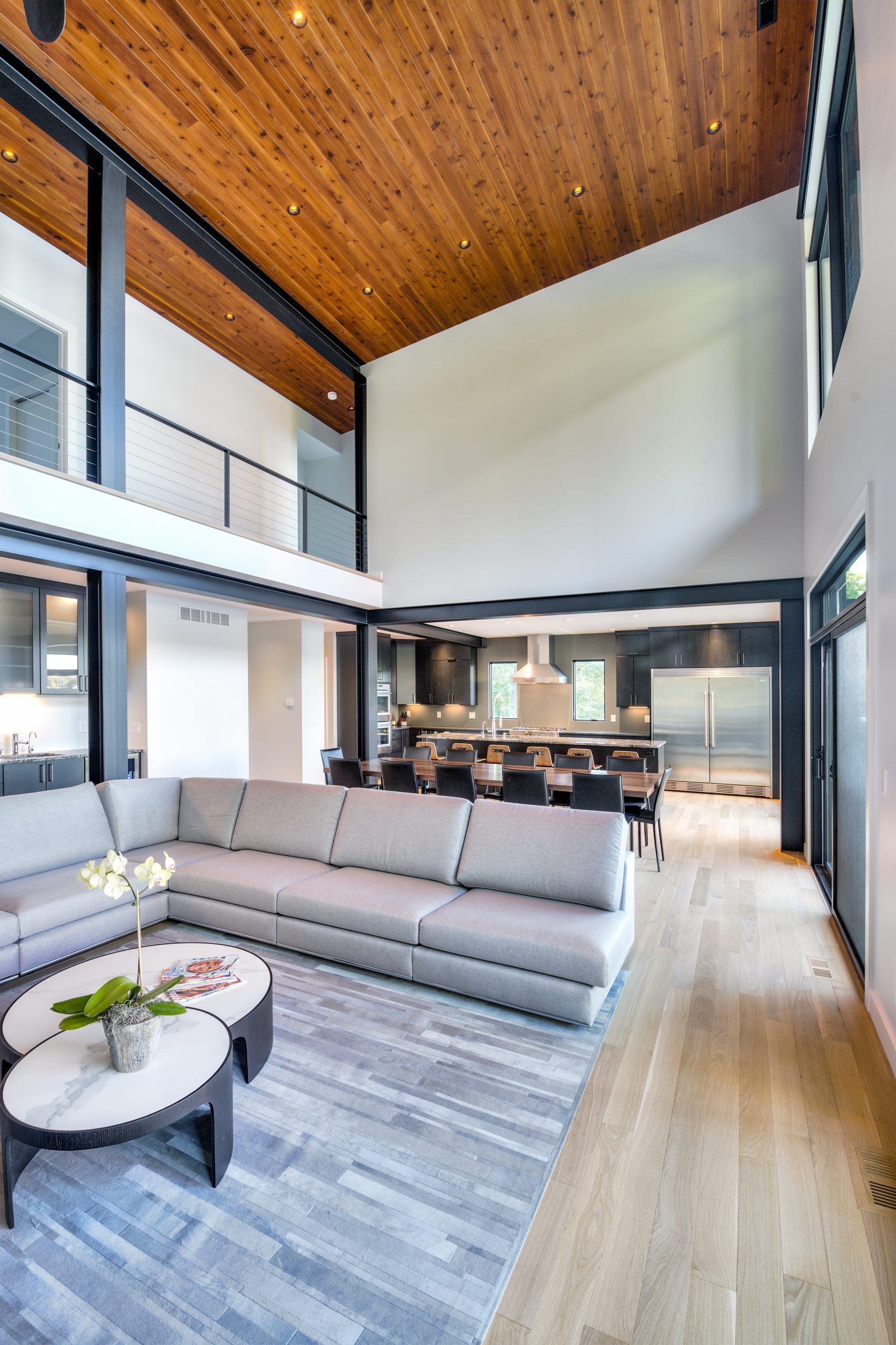 A living room with a large sectional couch and a coffee table.
