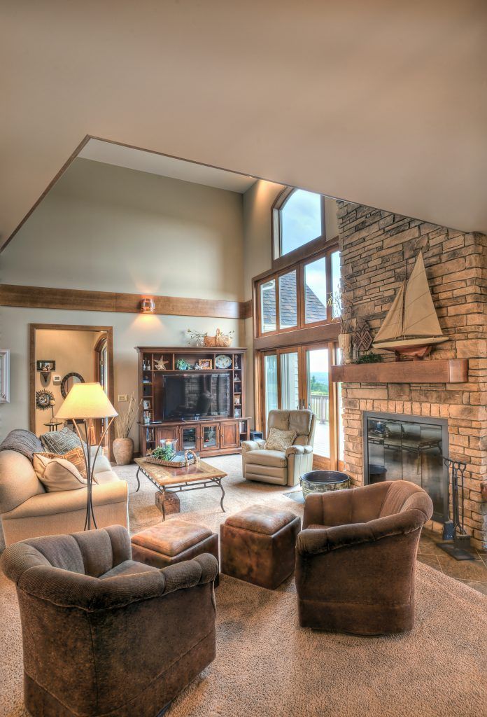 A living room filled with furniture and a fireplace.
