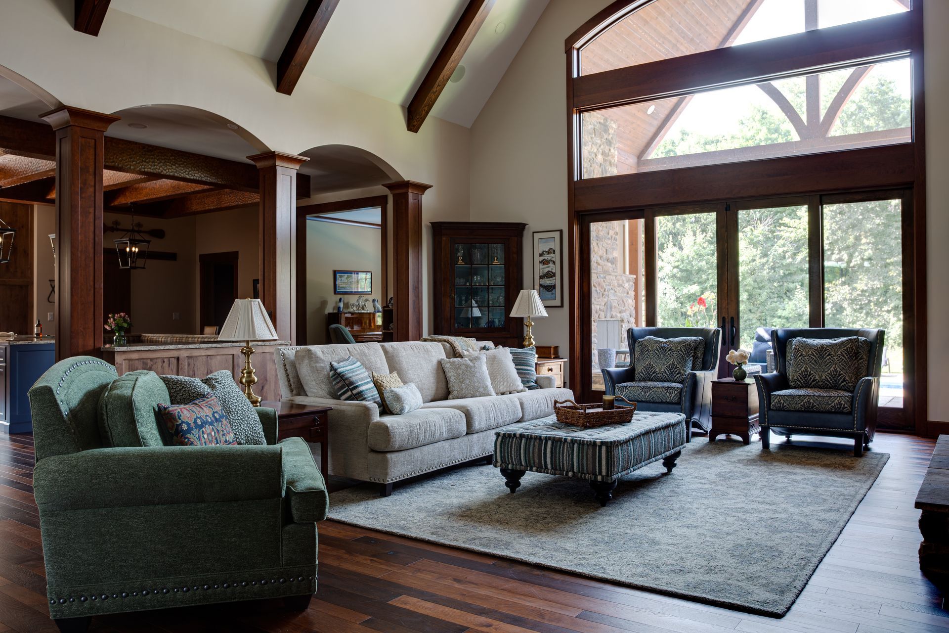 A living room with a couch and chairs and a coffee table.