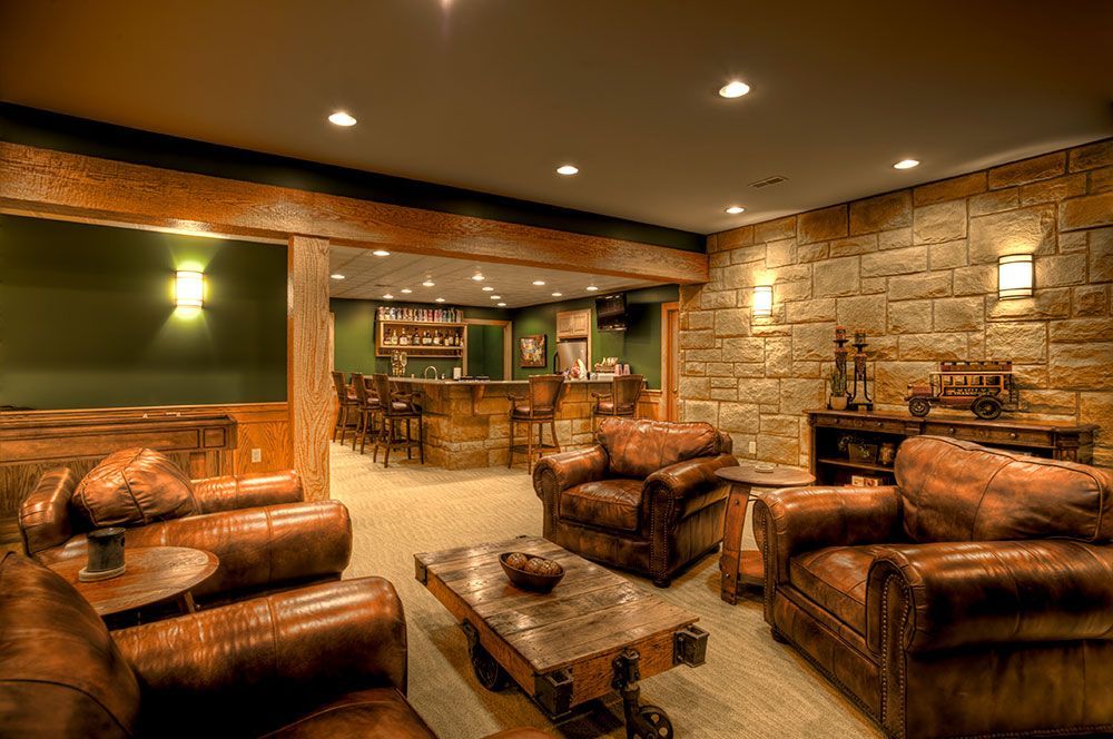 A living room filled with furniture and a bar.