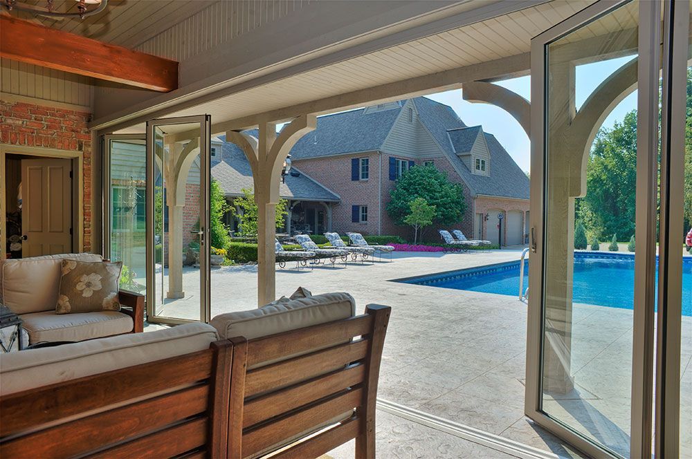 A large house with a swimming pool and a patio area.