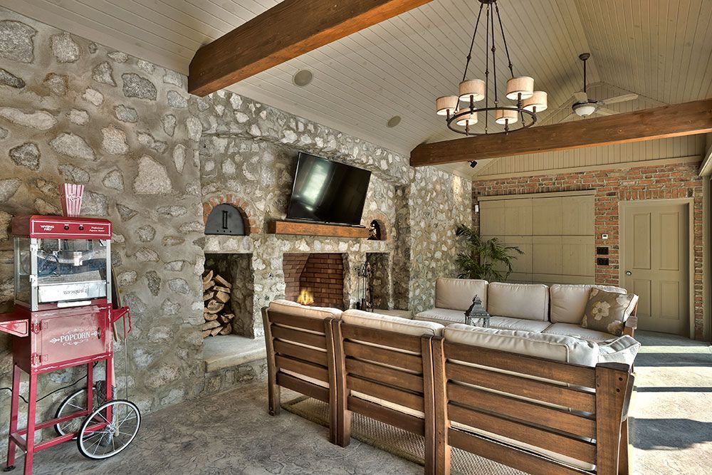 A living room with a couch and a popcorn machine.